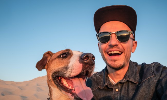Man and his dog doing a selfie outdoors
